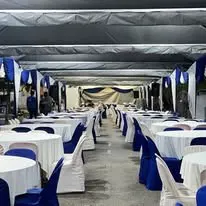 Canopy round table layout with blue sash chairs