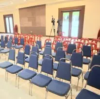 Blue banquet chairs arranged for seminar seating