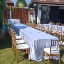 Garden banquet long table with gold Chiavari chairs