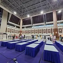 Hall table layout with blue table skirting
