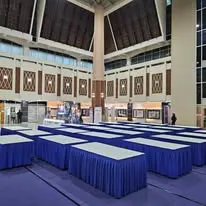 Hall table layout with blue skirting for programme setup