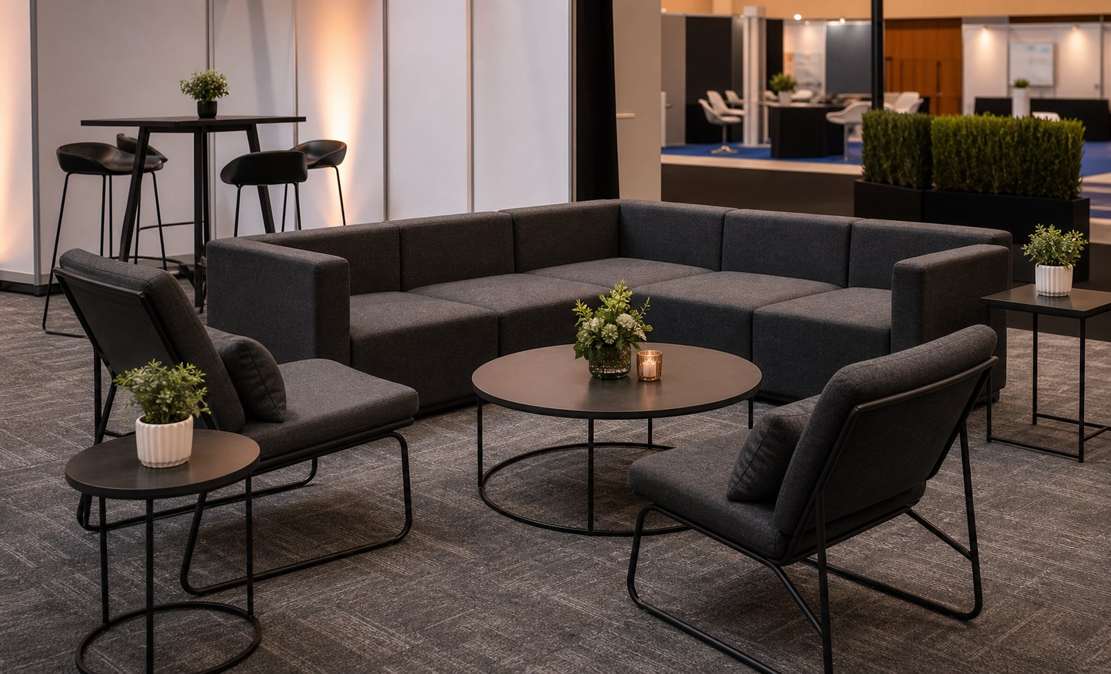 Grey modular sofa lounge with coffee tables for exhibition and corporate sponsor area