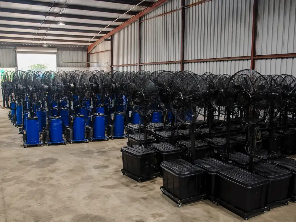 Standing mist fan rental units arranged in warehouse stock