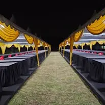 Night canopy long table setup with black and gold finish
