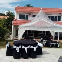 Outdoor black round table setup under canopy