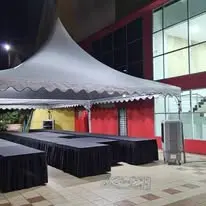 Outdoor canopy with black-covered tables