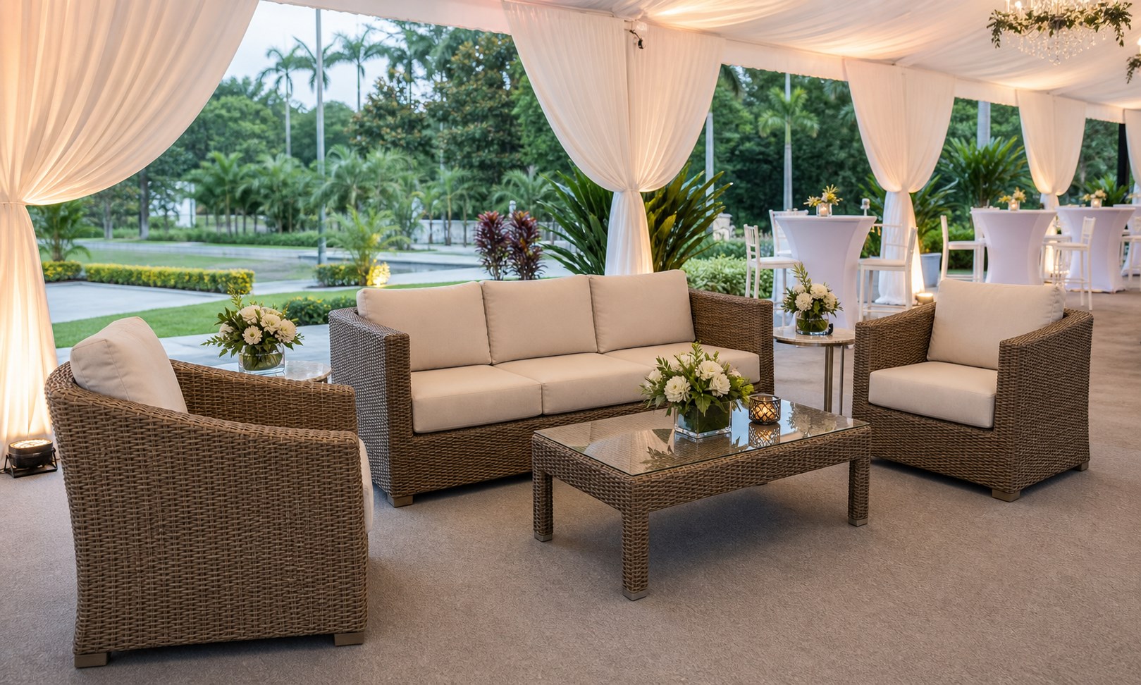 Outdoor rattan sofa lounge set under decorated canopy with tropical Malaysia garden backdrop