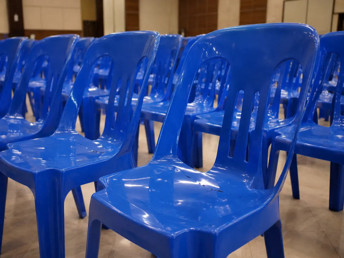 Blue plastic chair closeup for event seating