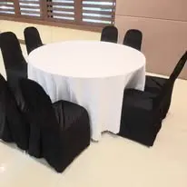 Round table with black chair covers